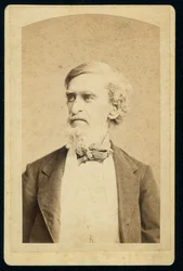 Photograph of Subject from Mid-Torso Up, Looking to the Left